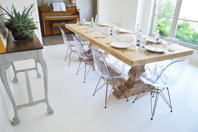 Mid-sized minimalist concrete floor kitchen/dining room combo photo in Oklahoma City with white walls and no fireplace