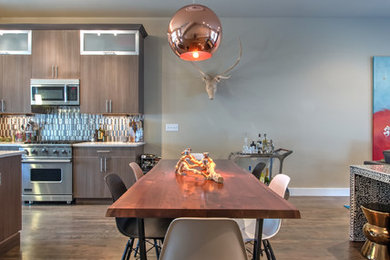 Mid-sized modern open plan dining in Denver with beige walls, dark hardwood floors and no fireplace.