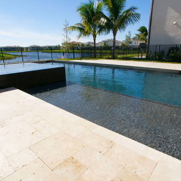 New Pool with Sunshelf and Pebble Tec Finish in Delray Beach Florida