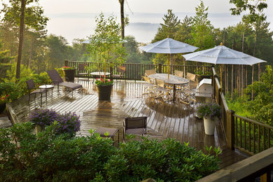 Example of a large classic backyard deck design in Other with no cover