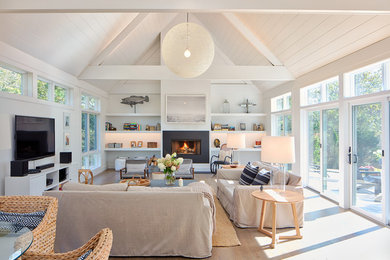 Example of a beach style living room design in Boston