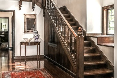 Mid-sized arts and crafts wooden straight wood railing staircase photo in Kansas City with wooden risers