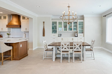 Example of a mid-sized classic ceramic tile and white floor kitchen/dining room combo design in Edmonton with white walls