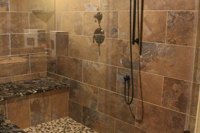 Bathroom - large rustic multicolored tile and porcelain tile porcelain tile bathroom idea in Cleveland with granite countertops