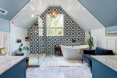 Transitional black and white tile white floor freestanding bathtub photo in Austin with blue cabinets, blue walls, a hinged shower door and gray countertops