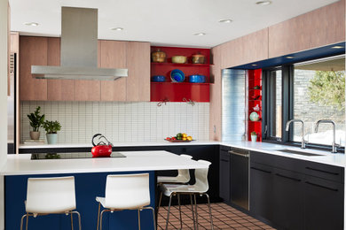 Inspiration for a contemporary l-shaped brown floor kitchen remodel in Minneapolis with an undermount sink, flat-panel cabinets, black cabinets, white backsplash, stainless steel appliances, a peninsula and white countertops