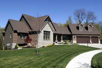 Mid-sized traditional brown two-story mixed siding house exterior idea in Orange County with a hip roof and a shingle roof