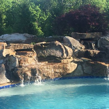 Custom boulder waterfall into the pool.