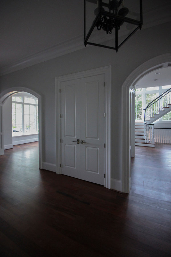 Powerful Impression by Floating Staircase in Suburban Foyer