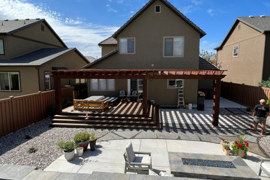 Example of a transitional patio design in Other