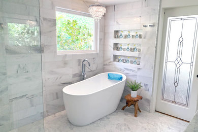 Bathroom - large traditional master white tile and marble tile marble floor, gray floor and double-sink bathroom idea in Los Angeles with shaker cabinets, white cabinets, a two-piece toilet, white walls, an undermount sink, marble countertops, gray countertops, a niche and a freestanding vanity