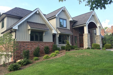 Design ideas for a mid-sized transitional two-storey brick grey exterior in Louisville.