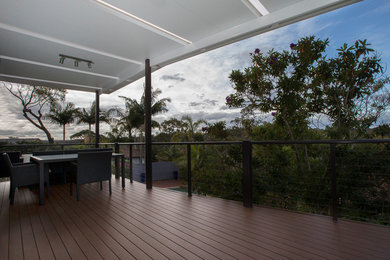 Design ideas for a large contemporary balcony in Sydney with a pergola and cable railing.
