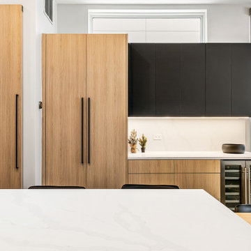 Sophisticated matte black and warm rift cut oak collision