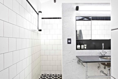 Inspiration for a large industrial master bathroom in Brisbane with recessed-panel cabinets, a wall-mount toilet, white tile, ceramic tile and white walls.