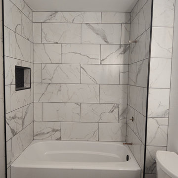 Custom Tile Tub Surround with Black Herringbone Mosaics