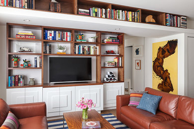 Living room - modern living room idea in San Francisco with white walls and a media wall