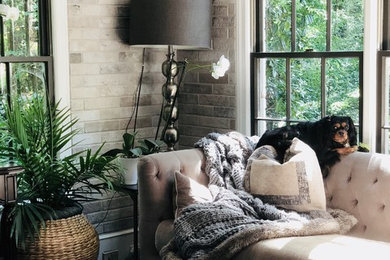 Example of a mid-sized transitional formal and enclosed dark wood floor and brown floor living room design in Atlanta with beige walls, no fireplace and a tv stand