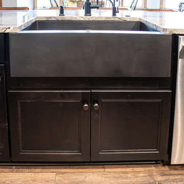Reconfigured kitchen with new islands, countertops, backsplash