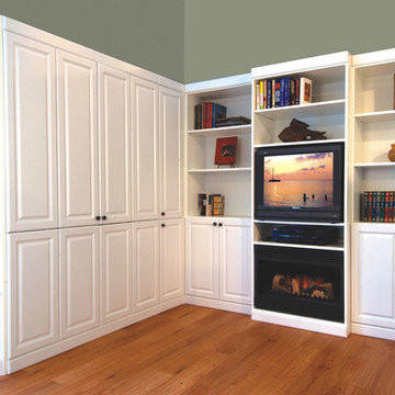 Traditional white murphy bed with bi-fold doors and TV area