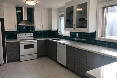 Mid-sized minimalist galley porcelain tile and white floor eat-in kitchen photo in Toronto with an undermount sink, shaker cabinets, gray cabinets, quartz countertops, green backsplash, ceramic backsplash, white appliances, no island and gray countertops