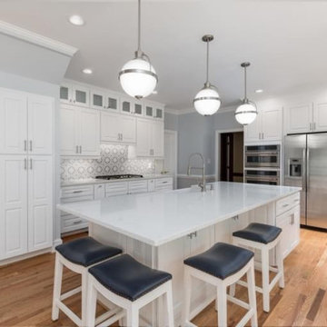 Sleek Modern Kitchen Remodel with White Cabinets & Grey Mosaic Backsplash