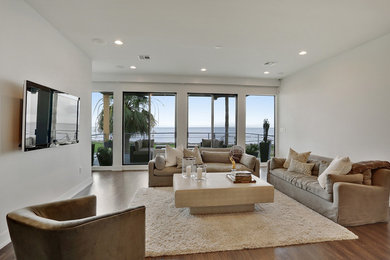 Living room - large modern open concept living room idea in New Orleans with a wall-mounted tv