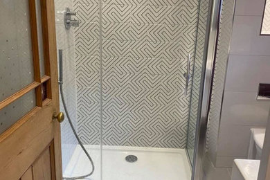 Design ideas for an ensuite bathroom in Hampshire with a single sink and a freestanding vanity unit.