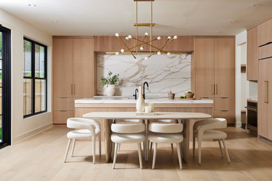 Example of a trendy kitchen design in Minneapolis with an island