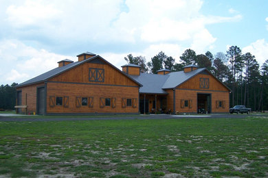 Example of a two-story wood exterior home design in Charleston