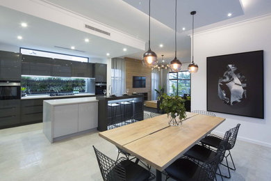 Design ideas for a mid-sized modern l-shaped open plan kitchen in Perth with a double-bowl sink, flat-panel cabinets, marble benchtops, window splashback and with island.