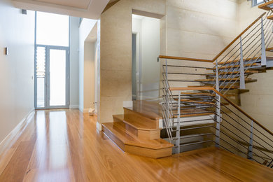Inspiration for a modern staircase in Perth with wood risers.
