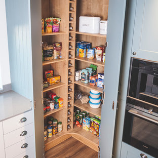 Mid-sized traditional kitchen pantry photos - Example of a mid-sized classic kitchen pantry design in Devon with shaker cabinets, blue cabinets and gray countertops