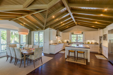 Large beach style u-shaped eat-in kitchen photo in Tampa with shaker cabinets, white cabinets, granite countertops, white backsplash, ceramic backsplash, stainless steel appliances and an island