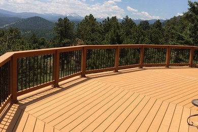 Large mountain style backyard deck photo in Denver with no cover