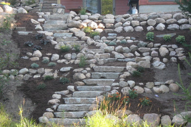 Boulder walls and steps to the river