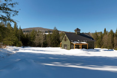 Small mountain style green exterior home photo in Burlington