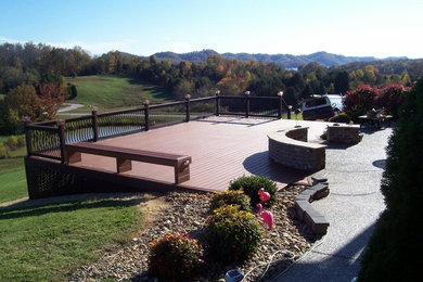 Mid-sized backyard deck photo in Other with no cover