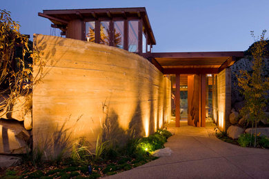 Mountain style entryway photo in Denver with a medium wood front door