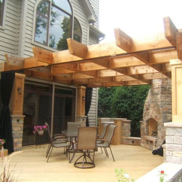 Cedar pergola with 4x12 rafters and beams and stone columns
