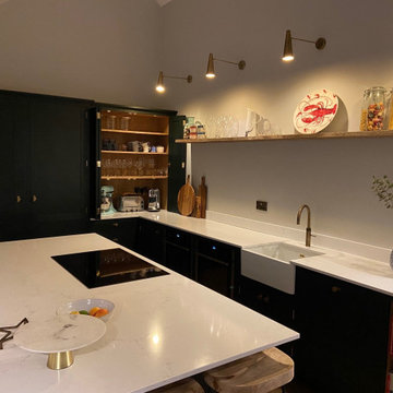 Large handmade kitchen with kitchen island and full length larder