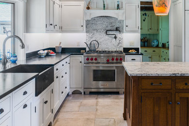 Example of a large farmhouse l-shaped eat-in kitchen design in Other with an island
