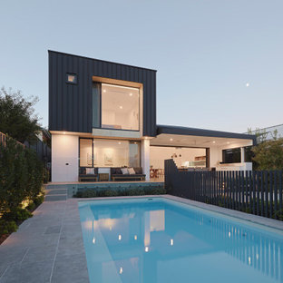 Inspiration for a modern backyard rectangular lap pool in Perth with tile.