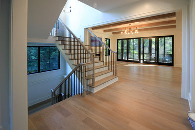 Inspiration for a large eclectic wooden floating mixed material railing and shiplap wall staircase remodel in DC Metro with painted risers