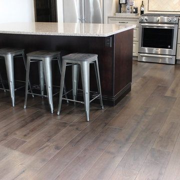 Farmhouse kitchen Taupe Painted Cabinets,Quartz Tops, and Dark Island