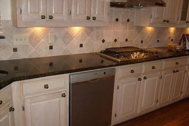 Medium tone wood floor kitchen photo in Dallas with beaded inset cabinets, light wood cabinets, granite countertops and stainless steel appliances