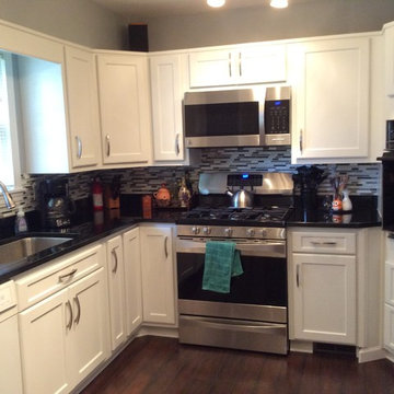 cabinet refacing--antique white shaker with granite countertops