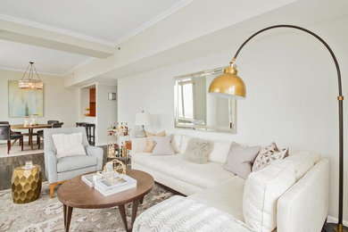 Inspiration for a mid-sized transitional open concept dark wood floor living room remodel in New York with white walls, no fireplace and a wall-mounted tv