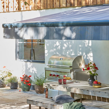 Outdoor Kitchen with Grey Striped Awning