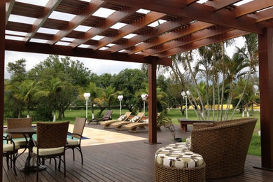 Example of an island style patio design in Other